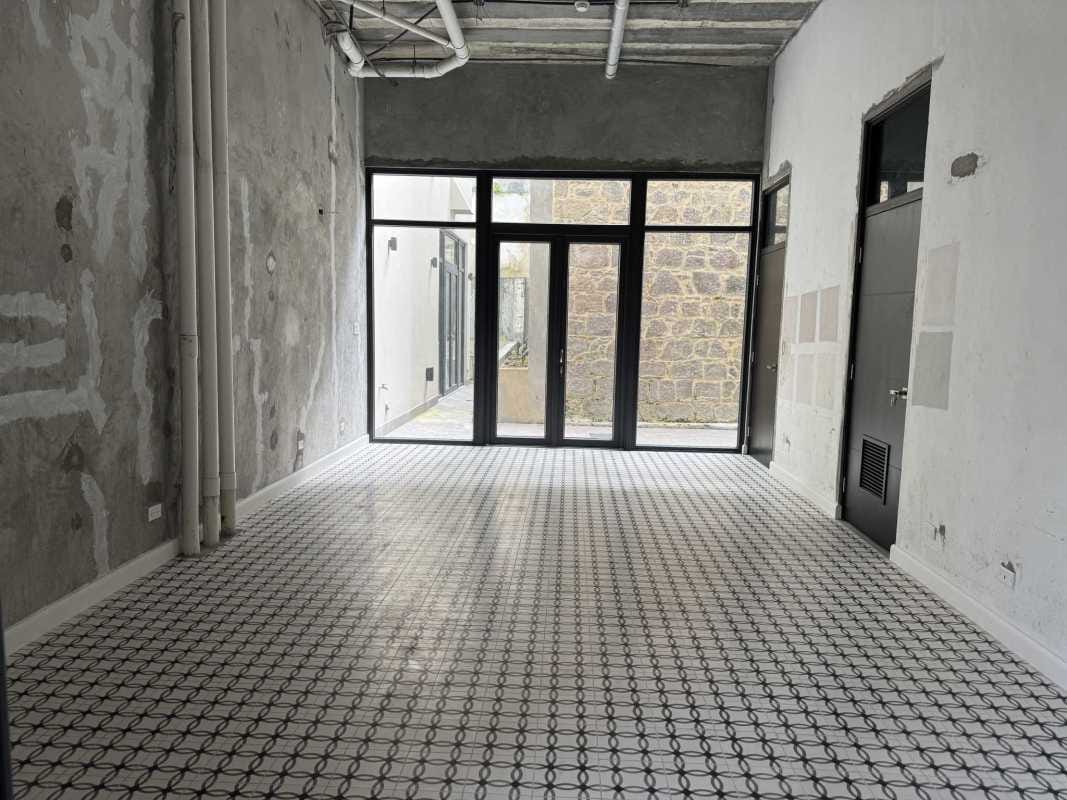 Outdoor commercial promenade stone walls vertical garden Casco Viejo Panama