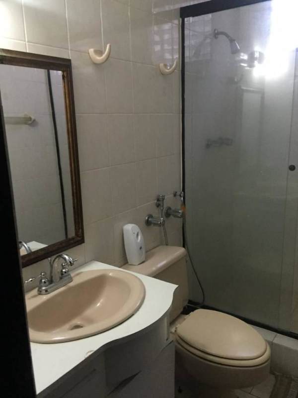 Beige tiled bathroom with glass shower in PH El Cangrejo Plaza Panama City