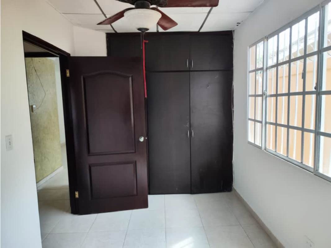 Bedroom featuring built-in wardrobe, ceiling fan, large window in Praderas de San Antonio Panama