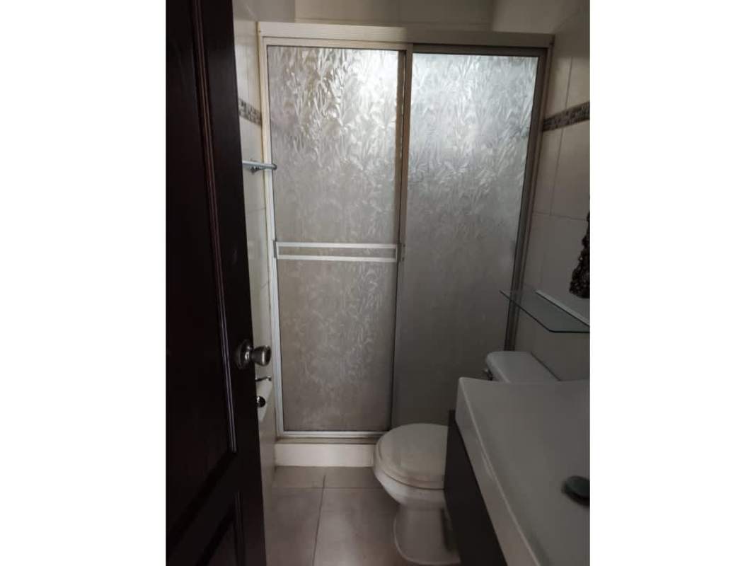 Contemporary bathroom featuring frosted glass shower, ceramic tiles, vanity sink at Praderas de San Antonio Panama