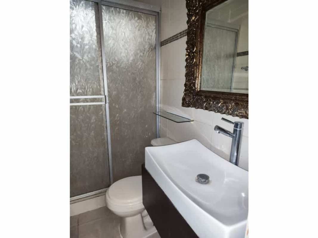 Updated bathroom with decorative mirror, frosted shower door, ceramic tiles Praderas San Antonio Panama