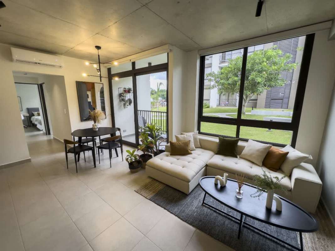 Modern kitchen with ceramic countertops white cabinets appliances at PH Begin CoLiving Brisas del Golf