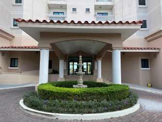 Spacious modern living room junior penthouse Vista Mar with panoramic floor to ceiling windows and ocean views