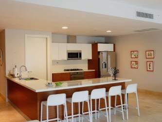 Bright primary bedroom king bed balcony garden view Puntarena Buenaventura Panama