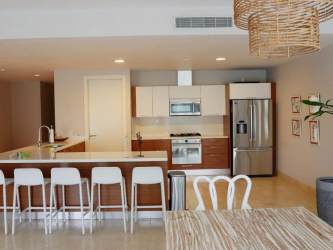 Bright guest bedroom with two beds and garden view in Puntarena Buenaventura Panama