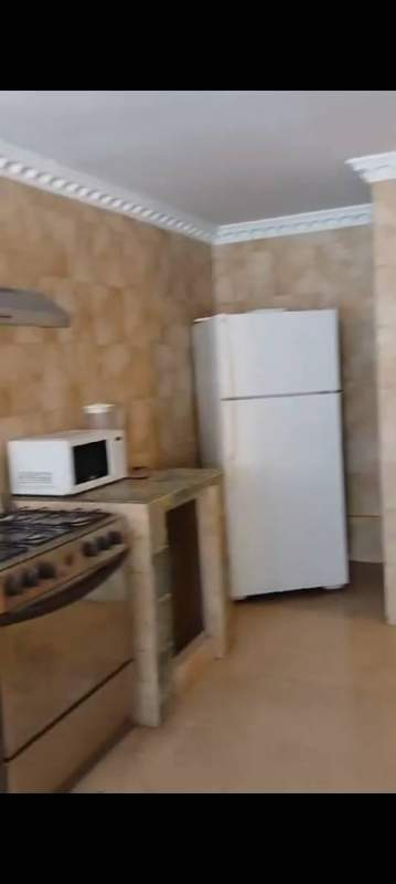 Dining space with large window, curtains, ceiling fan, dining furniture PH Obarrio Suites Panama City rental