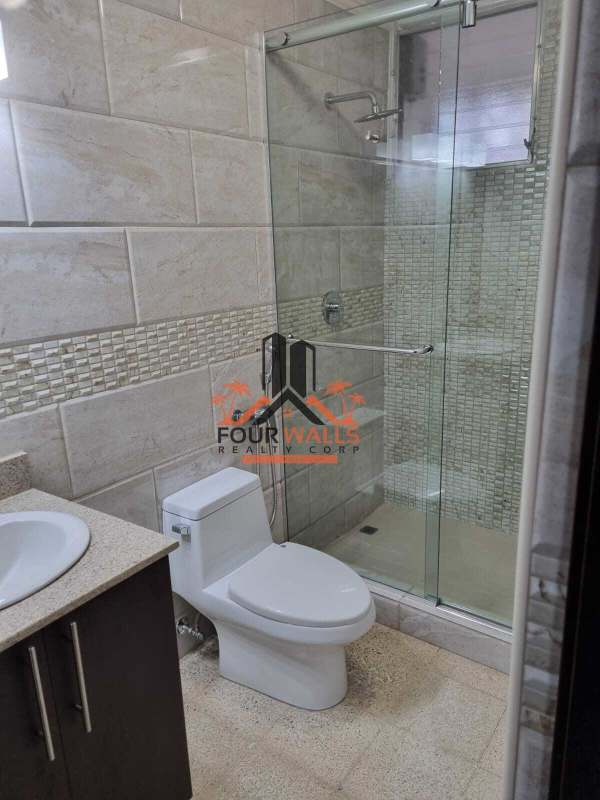 Remodeled bathroom with granite countertop, glass shower in PH Vista Hermosa Panama City