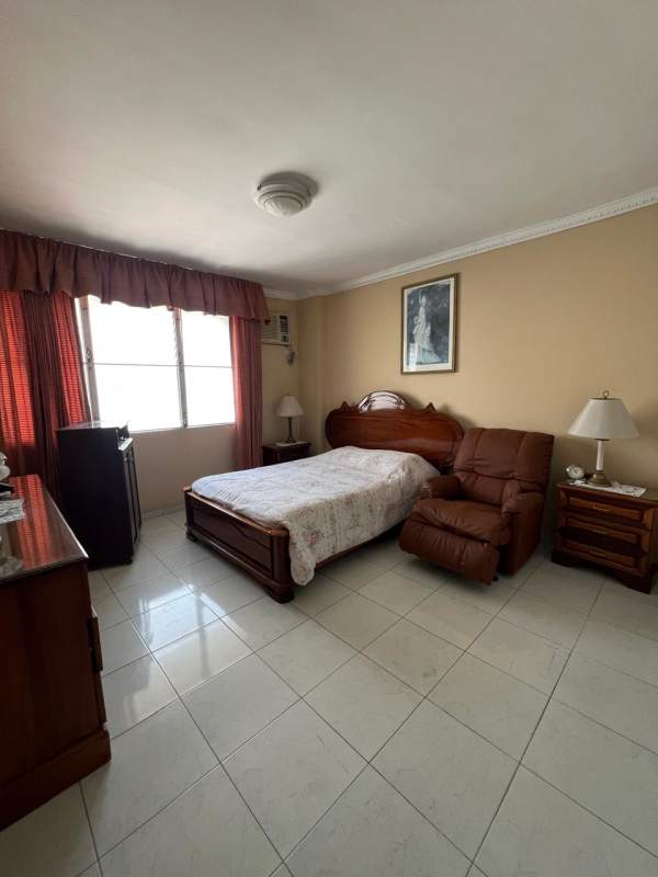 Large balcony with terracotta tiles overlooking skyline at PH Acquafredda Panama City