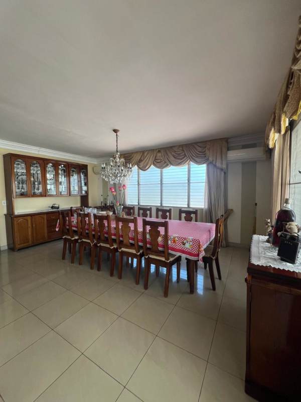 Bright kitchen with granite countertops, white cabinets, stainless appliances in PH Acquafredda Panama City