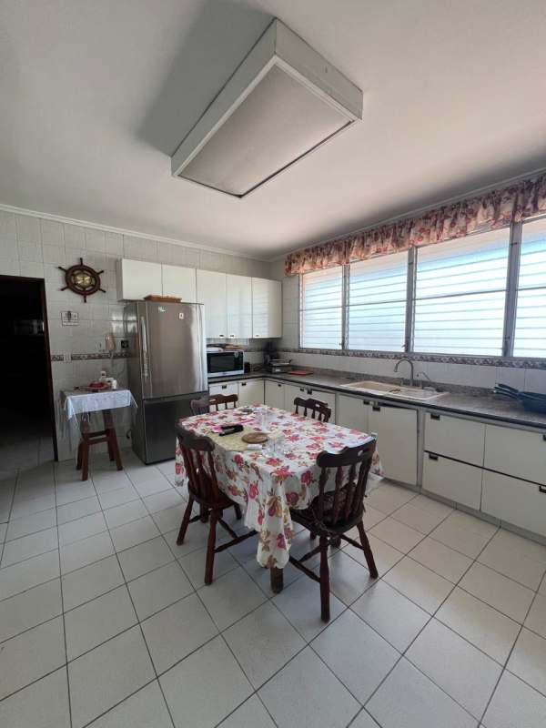 Traditional living room with tile flooring and large windows at PH Acquafredda