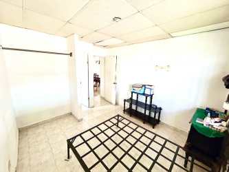 Minimalist style bedroom with tile flooring, white walls, metal bed at Brisas de Arraiján house Panama Oeste