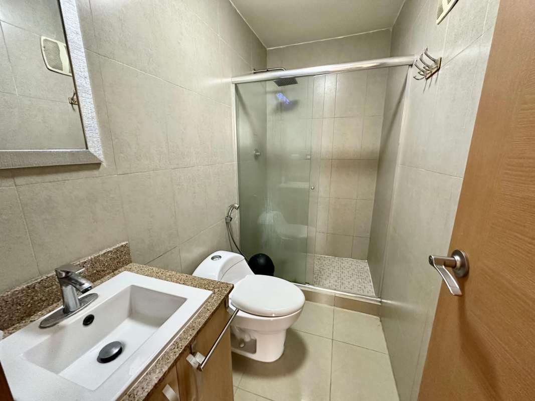 Bathroom with glass shower, granite countertop sink, tiled walls PH Rokas Condado del Rey Panama