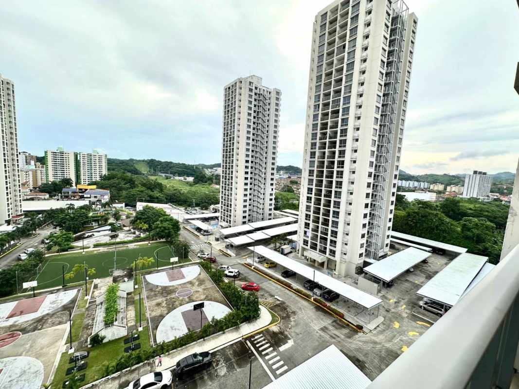Condominium towers with basketball court, parking areas and green spaces at PH Rokas Panama