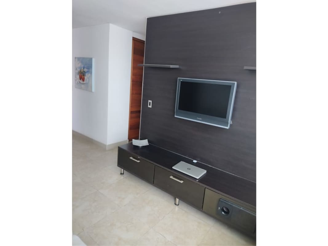 Contemporary dining and living room with ocean views and balcony access at PH Terras San Francisco Panama