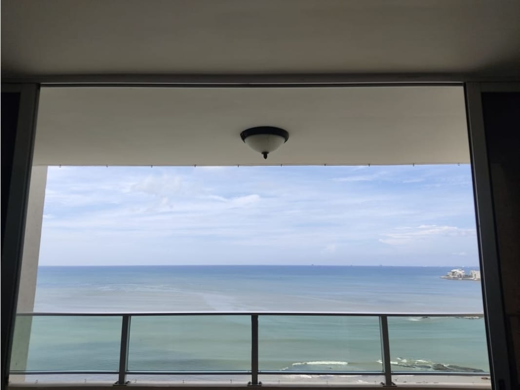 Balcony with glass railing offering panoramic Pacific view at PH Terras Panama City