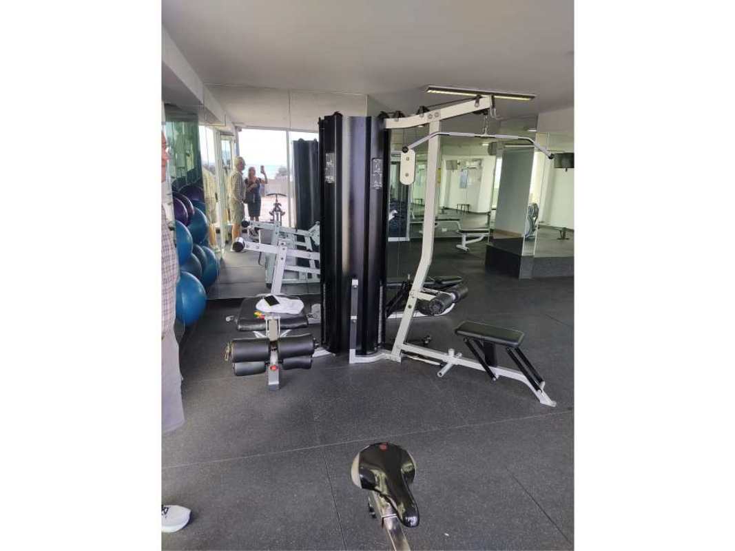 Indoor gym with equipment and mirrored walls at PH Terras San Francisco Panama