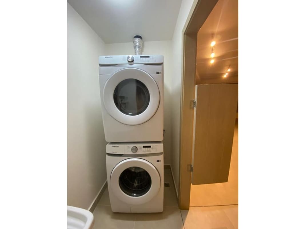 Modern lounge bar area with green wall and luxury decor at PH Oceana Santa Maria Panama