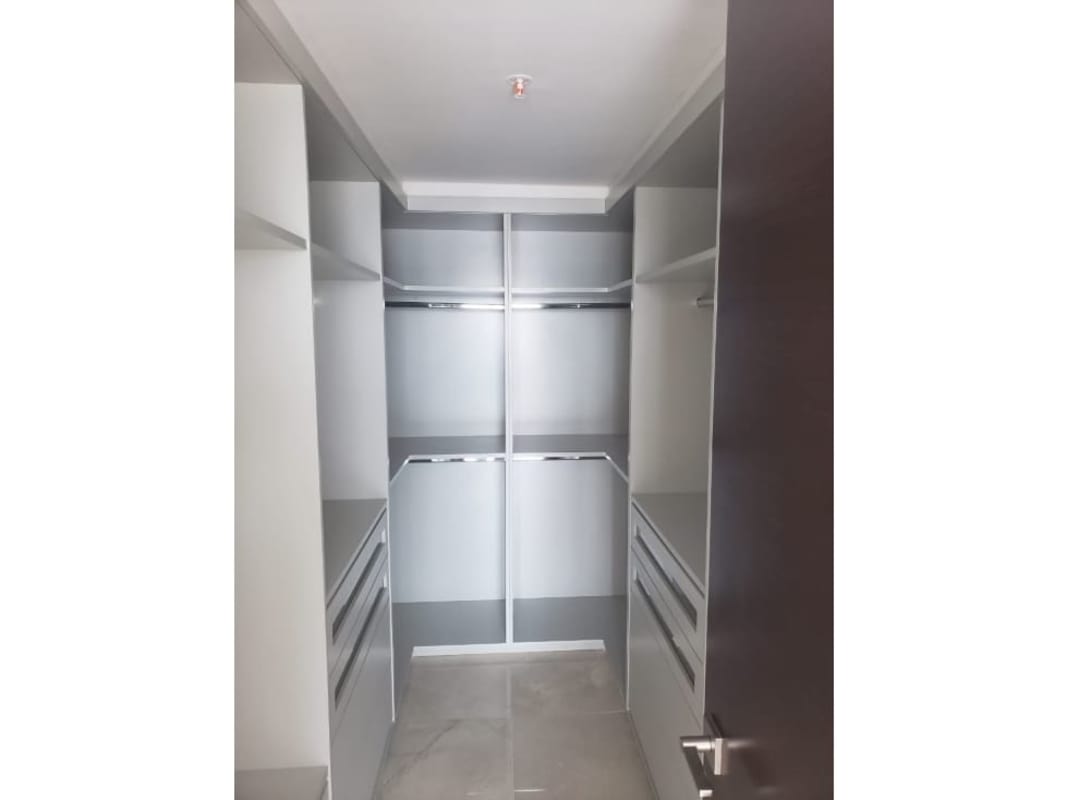 Designer kitchen with built-in appliances island and quartz counters in PH Green Garden Santa María Panama