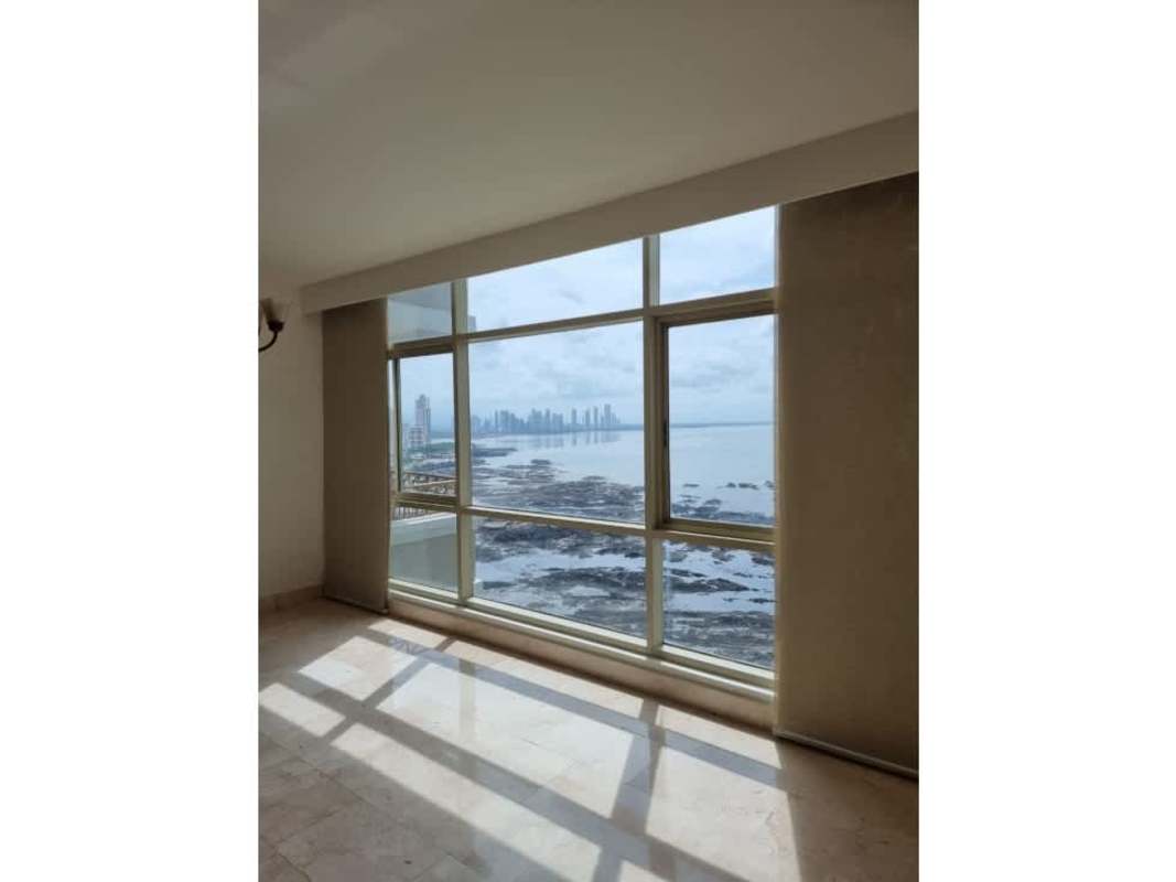 Luxury master bedroom with large windows overlooking ocean skyline in PH Pacific Point Punta Pacifica Panama