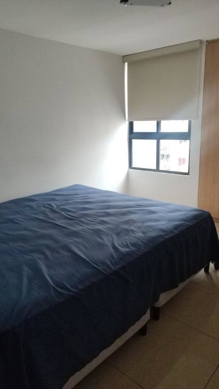 Minimalist bedroom with built-in wardrobe and window PH Terrazas del Rey Condado del Rey Panama