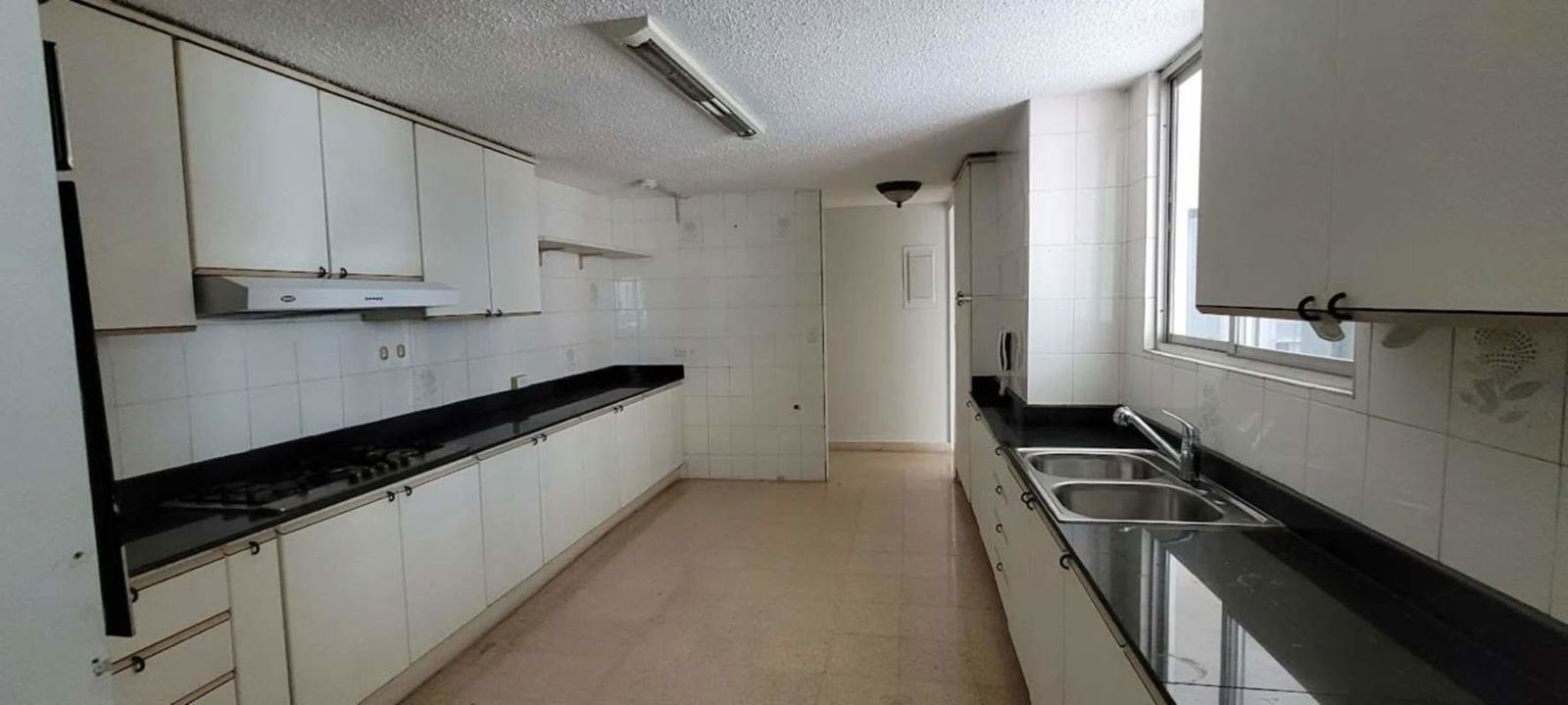 Spacious apartment kitchen with granite countertops and appliances Punta Paitilla
