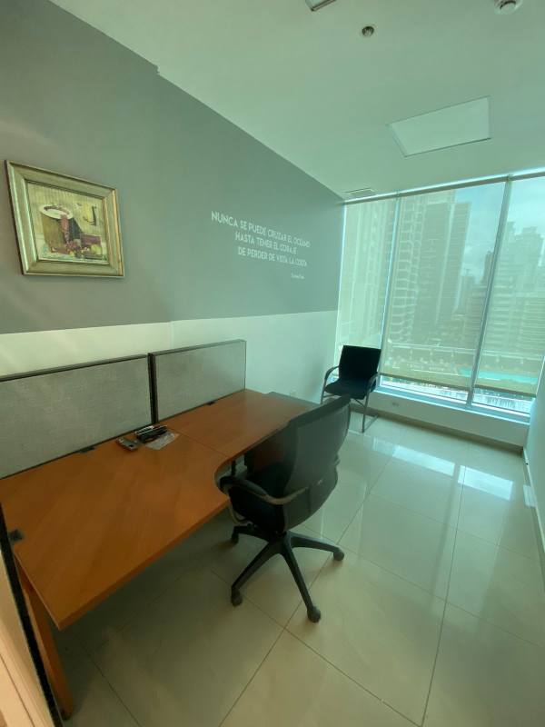 Partitioned modern office workstations with window views in Ocean Business Center Panama