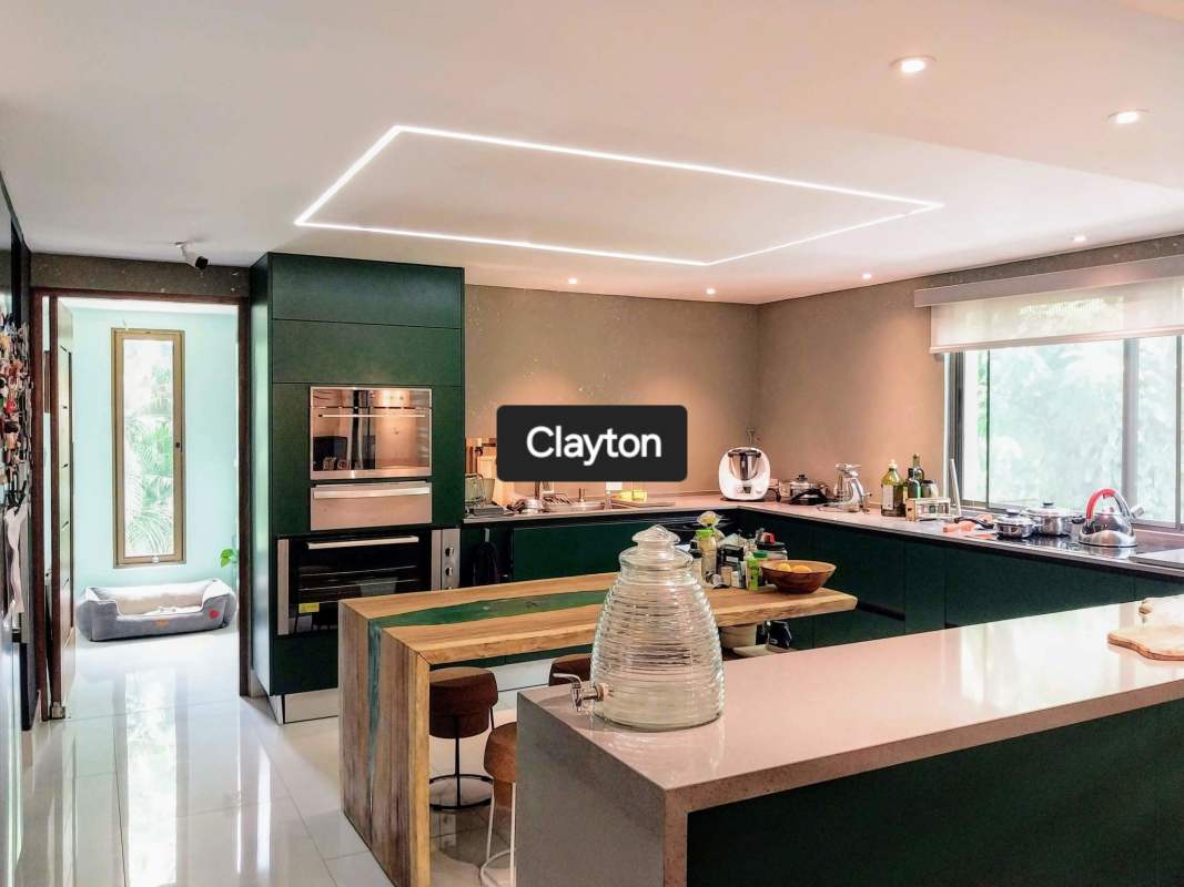 Spacious double height foyer with pendant lights in renovated Clayton house rental Panama