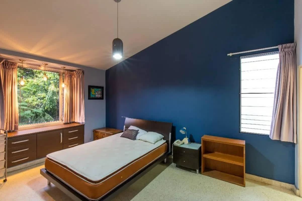 Interior loft and workspace with staircase and wood accents in house in Obarrio Panama