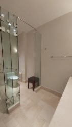 Elegant bathroom with glass shower and vanity in oceanfront apartment PH Puntarenas Buenaventura Panama