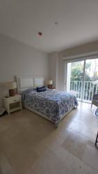 Bedroom with balcony access and ocean views at PH Puntarenas Buenaventura Panama