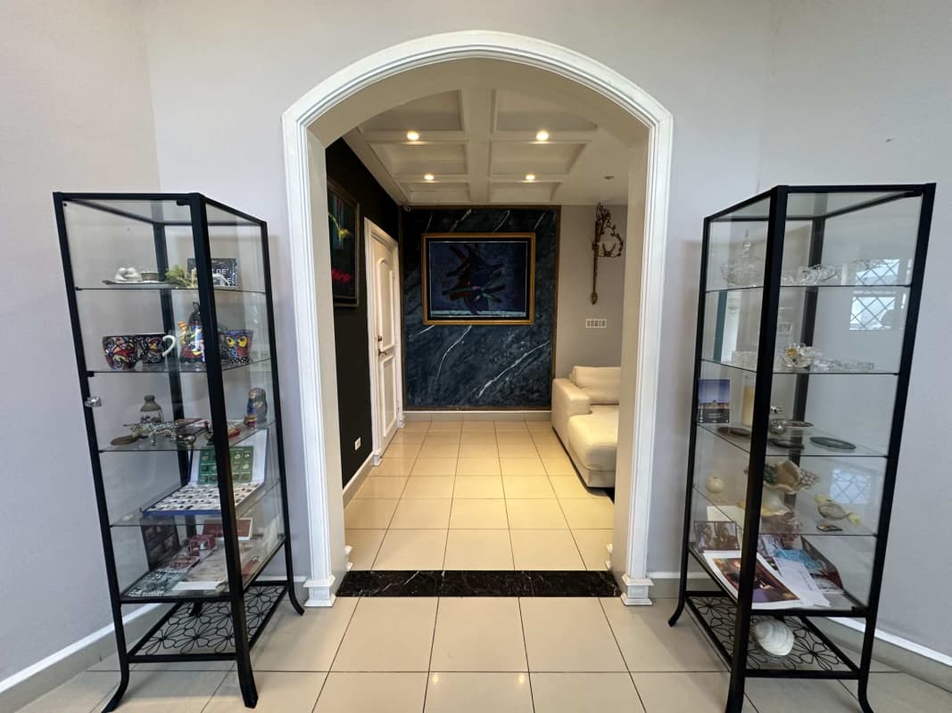 Double door foyer with chandelier and marble floors in Altos del Golf mansion Panama