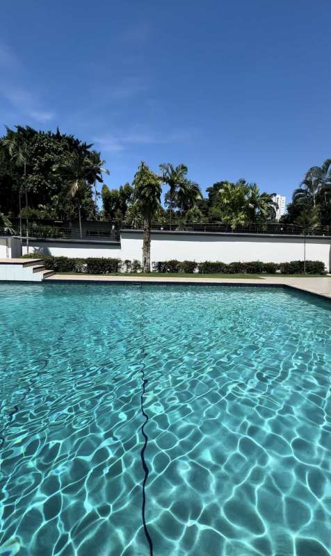 Swimming pool with jacuzzi gazebo lush landscaping at Altos del Golf mansion Panama