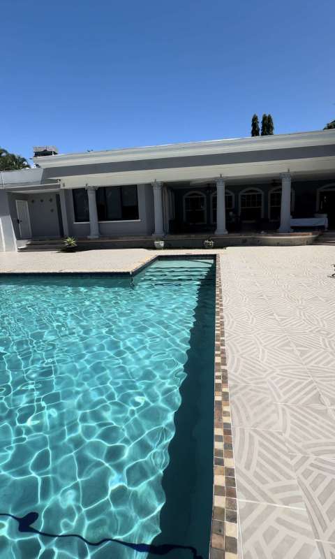Mediterranean style pool backyard with pergola and garden Altos del Golf luxury house Panama City