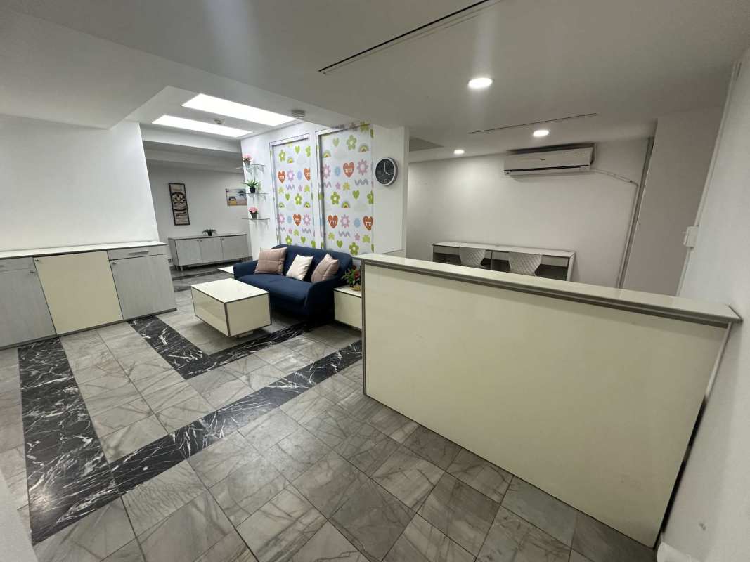 Modern minimalist lobby with tile floor and skylights in Torre BAC Panama City