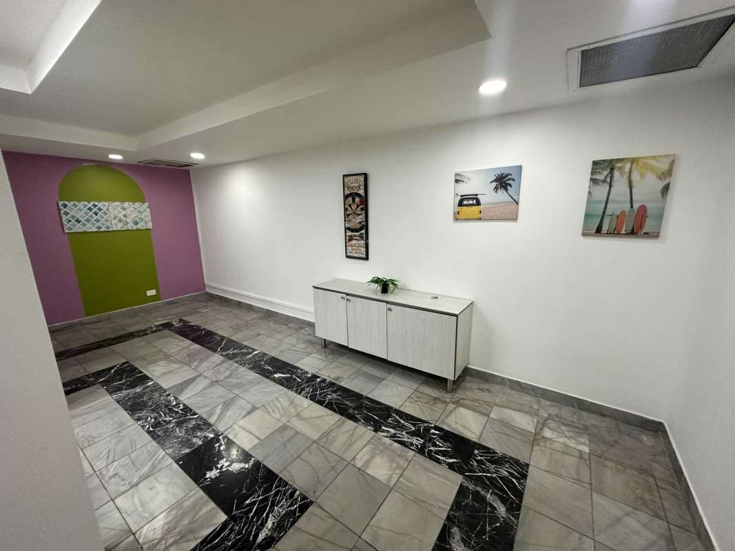 Bright minimalist office space with conference setup and AC Torre BAC Panama City