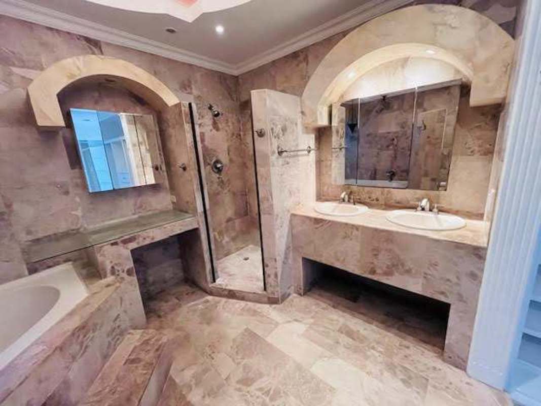 Spacious living room with tile floor, terrace view in duplex house La Alameda Panama