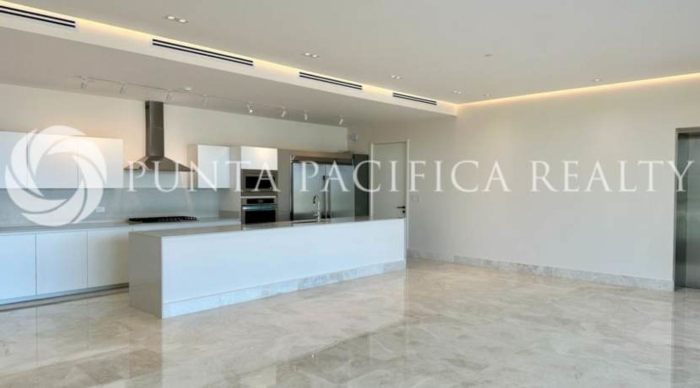 Bright living room and dining with marble floors, floor-to-ceiling glass panoramic ocean view at Ocean Reef Islands Panama