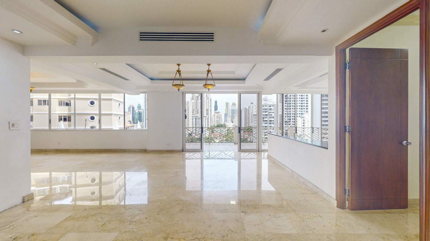 Traditional kitchen with granite counters, wood cabinets, window view in PH Terranova El Cangrejo Panama City