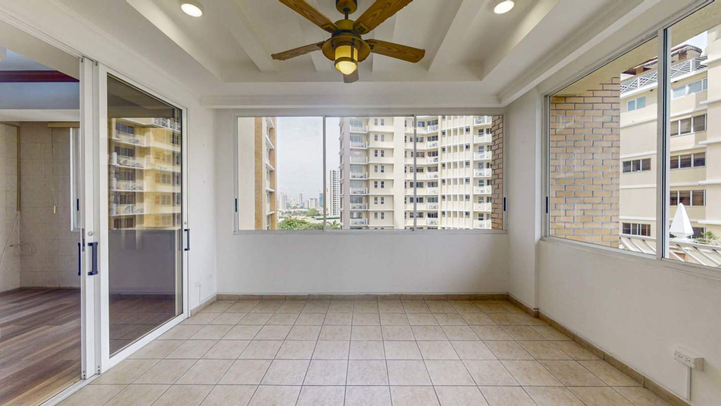 Master bedroom with large window, en-suite bath, city skyline views at PH Terranova Panama