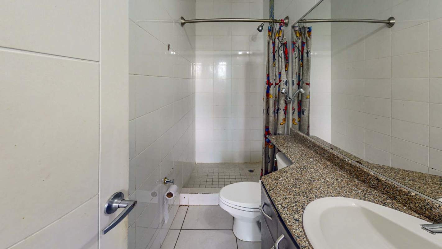 Contemporary bathroom with walk-in shower, granite counter, large mirror in Green Park Tower 500