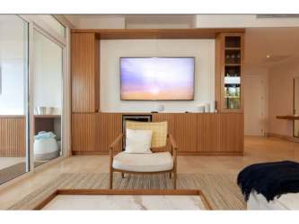 Modern living space with sliding glass doors overlooking marina in Marina Village Rio Hato Panama