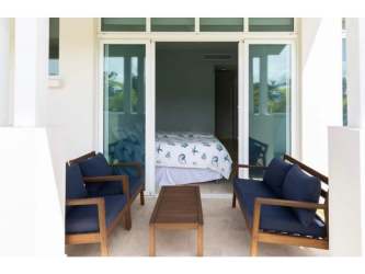 Bedroom with sliding doors to terrace, natural light, coastal decor in Marina Village Buenaventura Panama