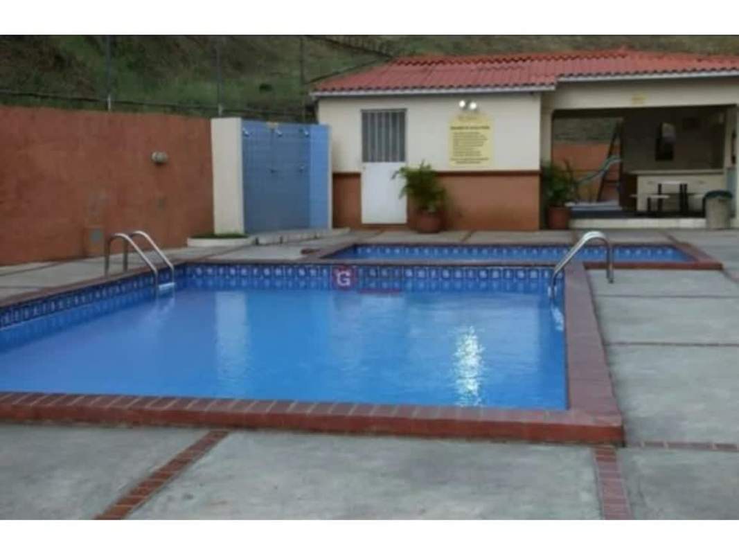 Community pool with changing rooms at Mallorca Park Village in Los Andes Panama