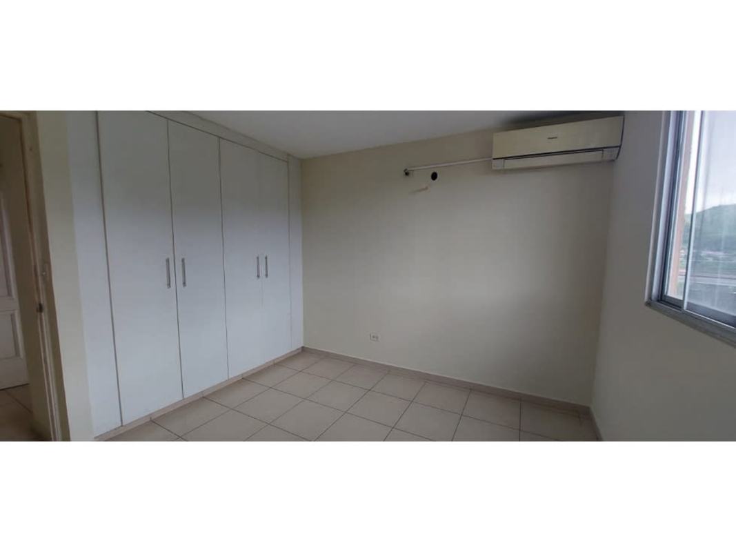 Main bedroom with built-in closet, AC unit, window at Mallorca Park Village Los Andes Panama