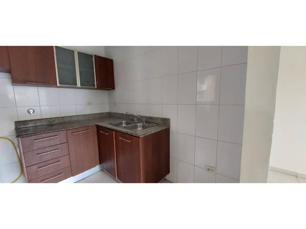 Compact kitchen with granite countertop and cabinets at Mallorca Park Village Los Andes Panama