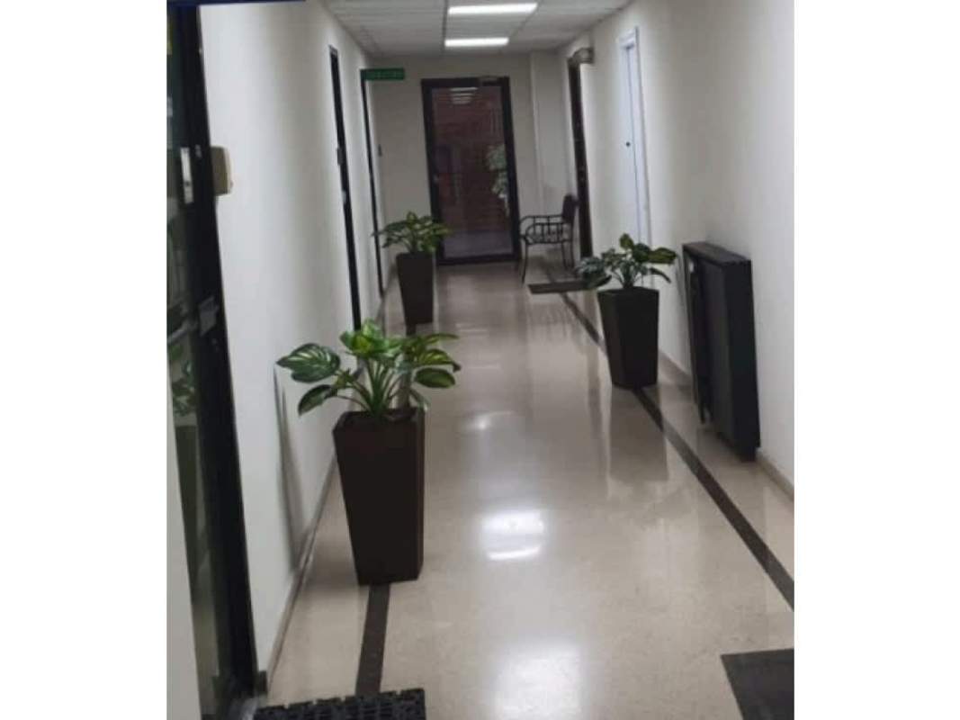 Modern hallway with elevator and natural light at Plaza San Fernando commercial center