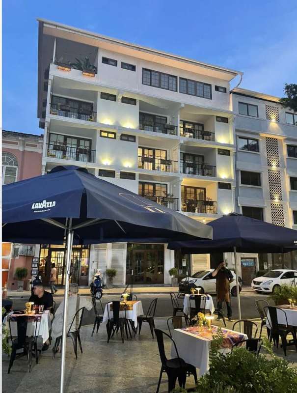 Historic building with balconies and street-front dining in Casco Viejo, PH Plaza Santa Ana Panama City
