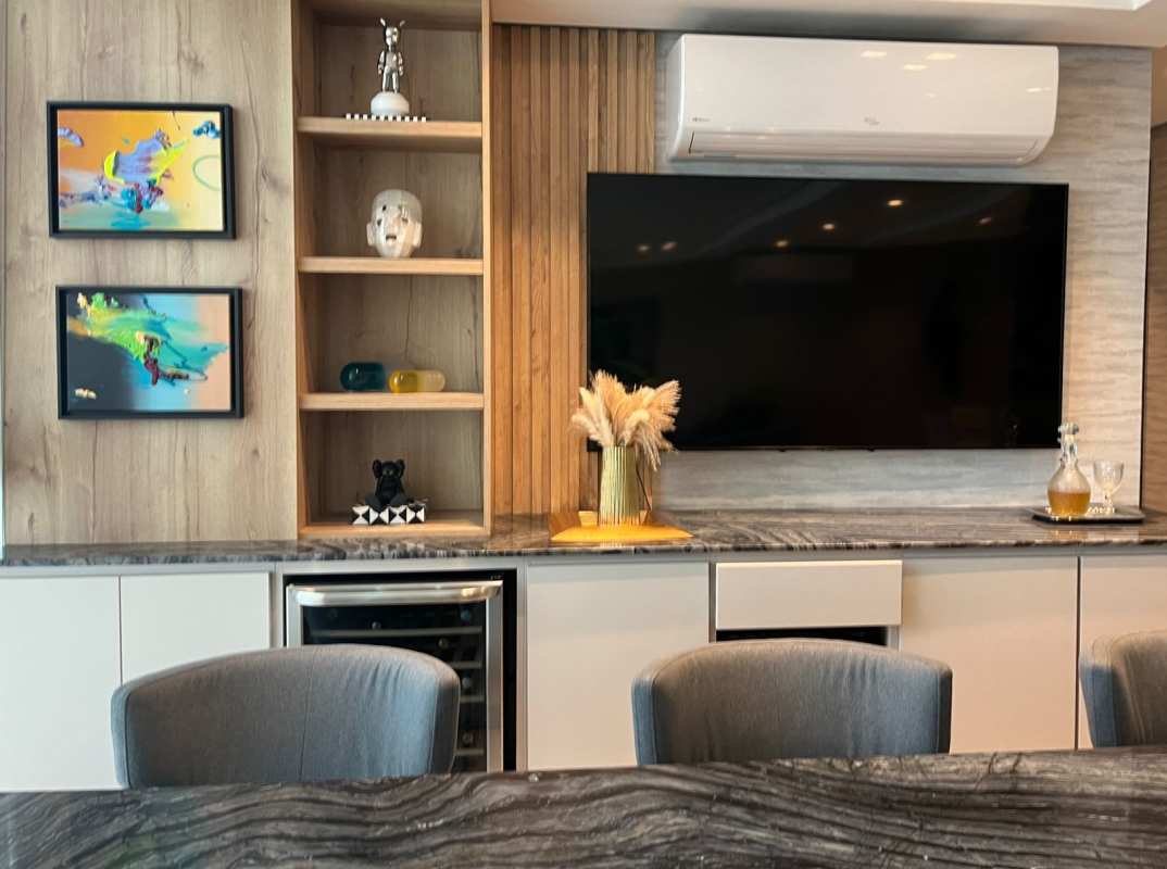 Built-in entertainment center with TV and shelving at Asia Costa del Este condo