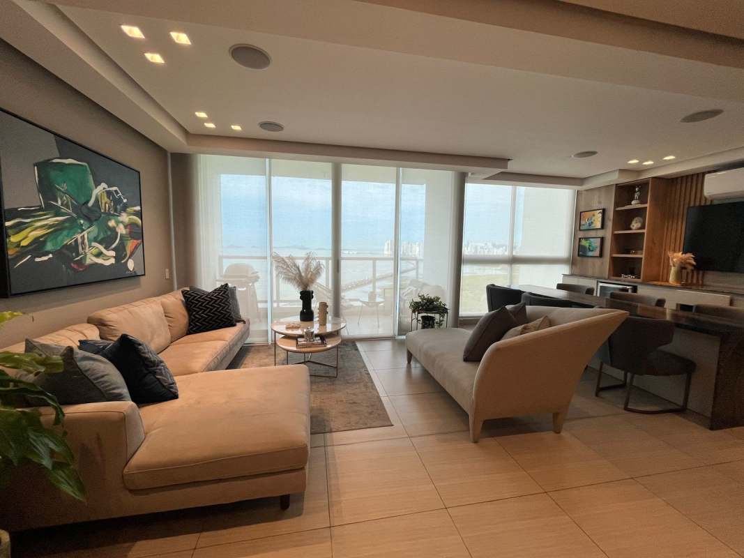Bright living dining room with tile floors, panoramic windows, ocean view at PH Asia Costa del Este