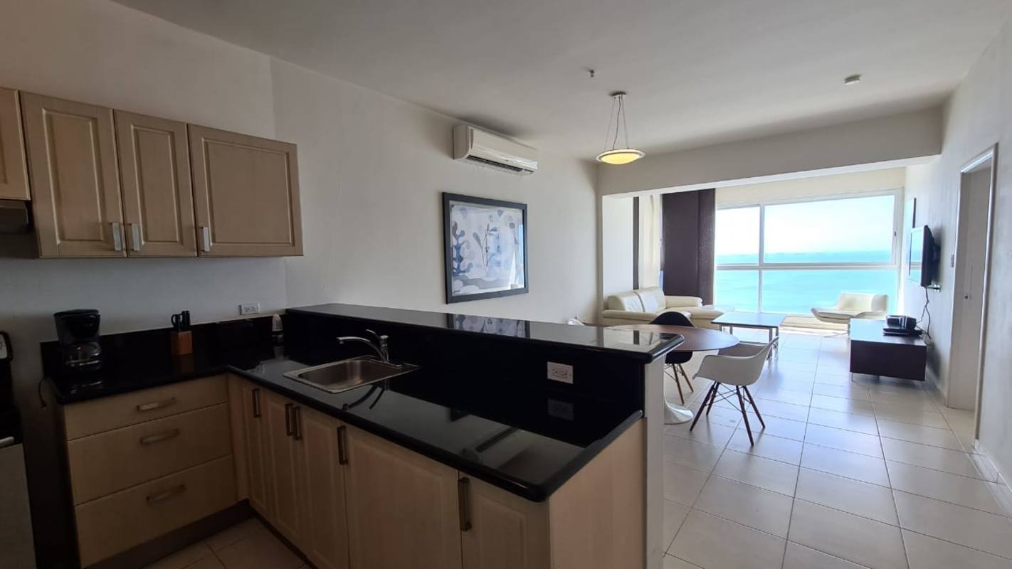 Sleek granite kitchen with stainless appliances in PH Vista del Mar Avenida Balboa Panama City